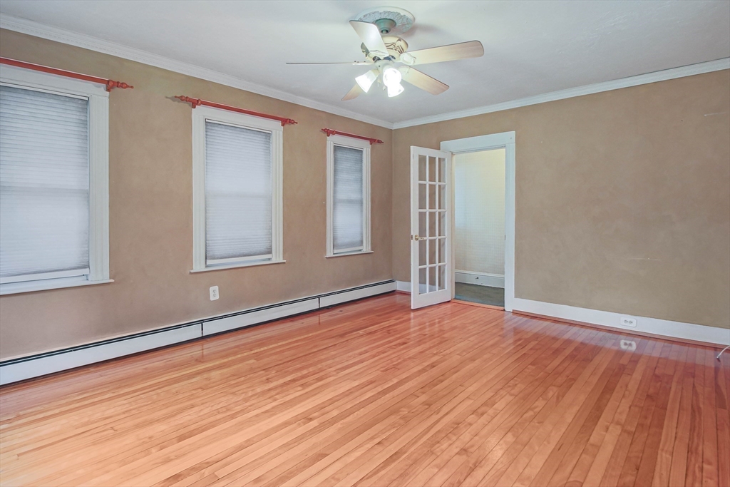 13 Superior Road Worcester, MA 01604 - Photo 21 of 40 a view of an empty room with wooden floor and a window