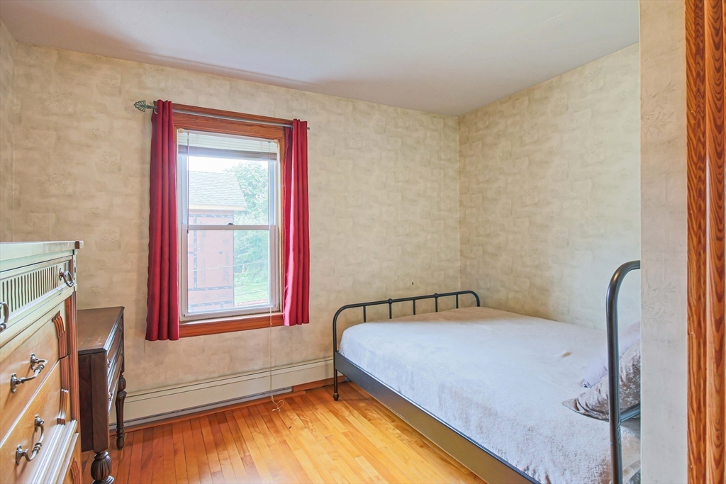 13 Superior Road Worcester, MA 01604 - Photo 29 of 40 a bedroom with a bed and a window