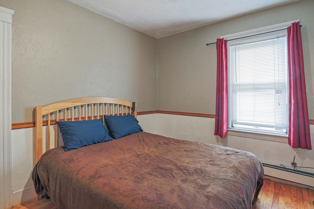 13 Superior Road Worcester, MA 01604 - Photo 31 of 40 a bedroom with a bed and window