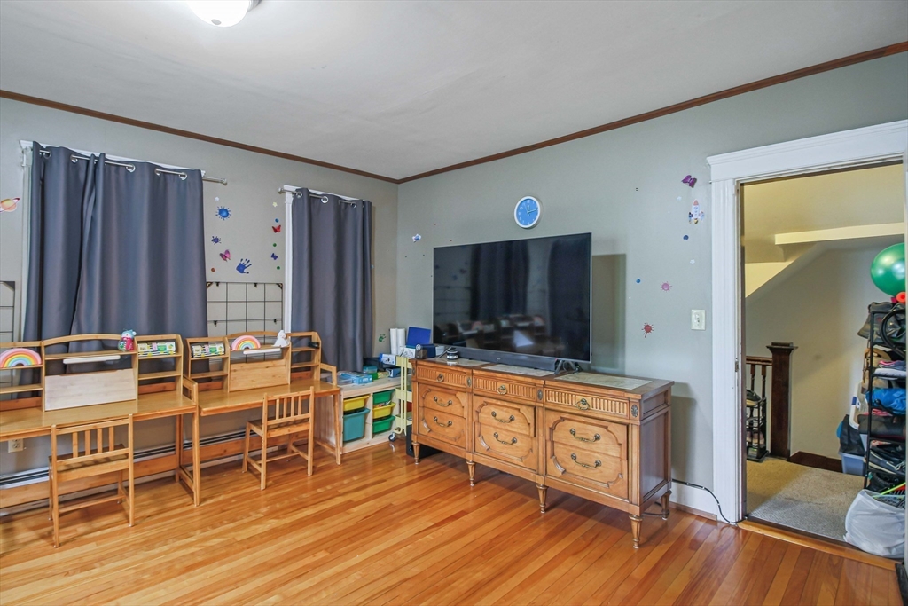 13 Superior Road Worcester, MA 01604 - Photo 38 of 40 a living room with furniture a flat screen tv and a wooden floor
