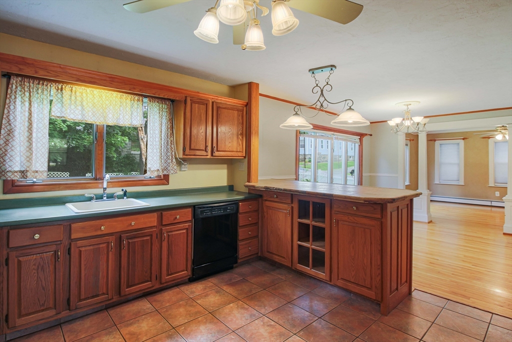 13 Superior Road Worcester, MA 01604 - Photo 6 of 40 a kitchen with stainless steel appliances granite countertop a stove and a sink