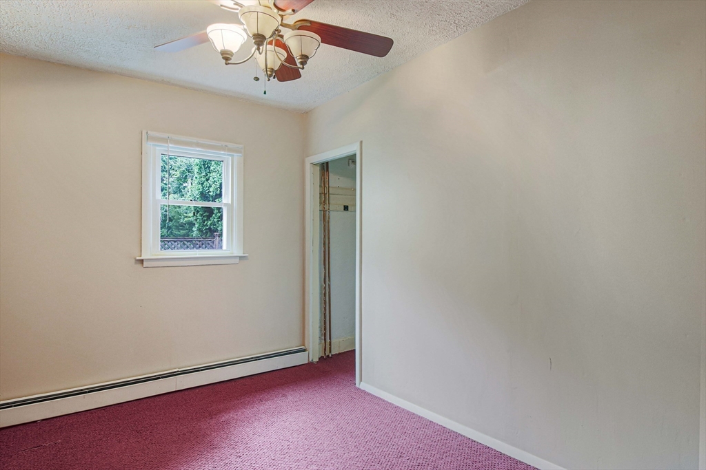 13 Superior Road Worcester, MA 01604 - Photo 9 of 40 an empty room with windows and fan