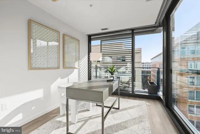 a workspace with furniture and a window