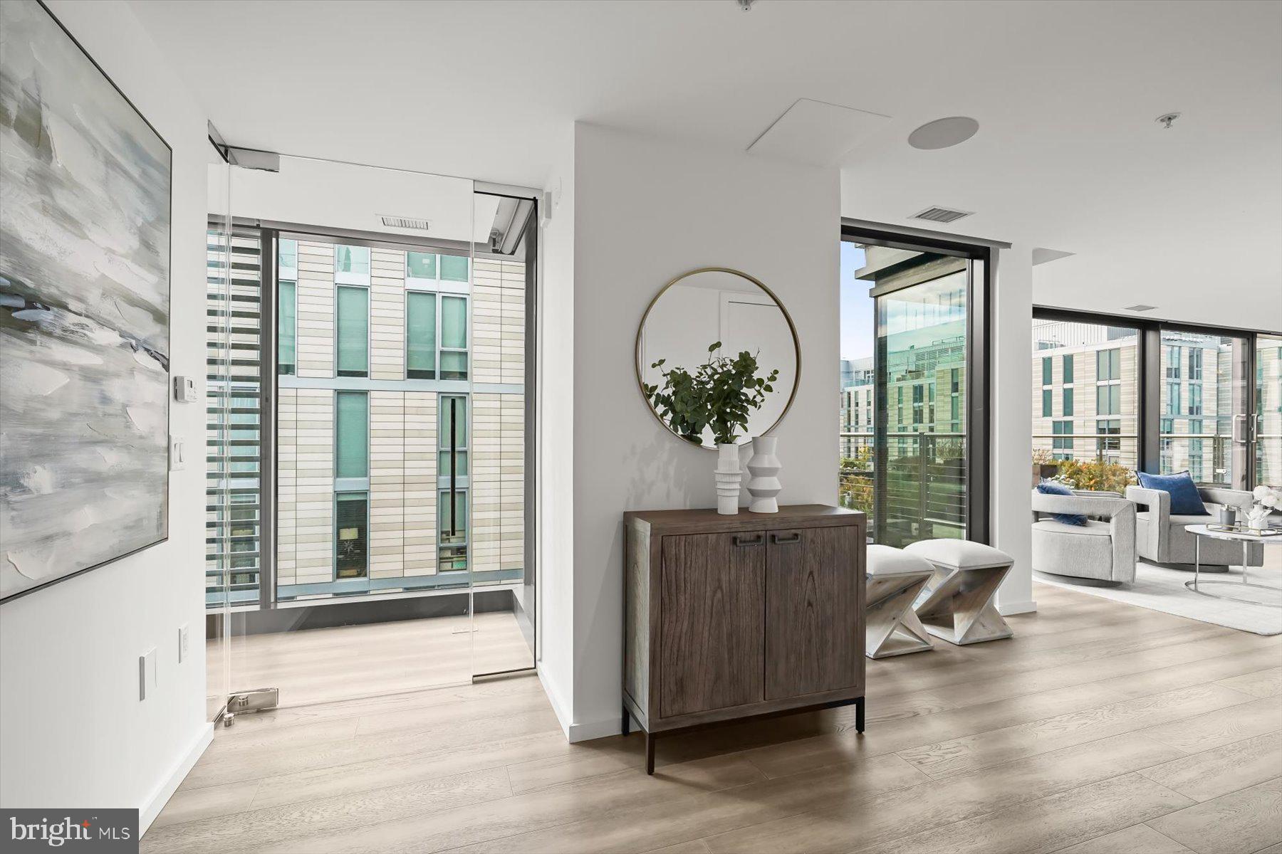 925 H Street Northwest, Unit 901/902 Washington, DC 20001 - Photo 2 of 29 a living room with furniture and wooden floor