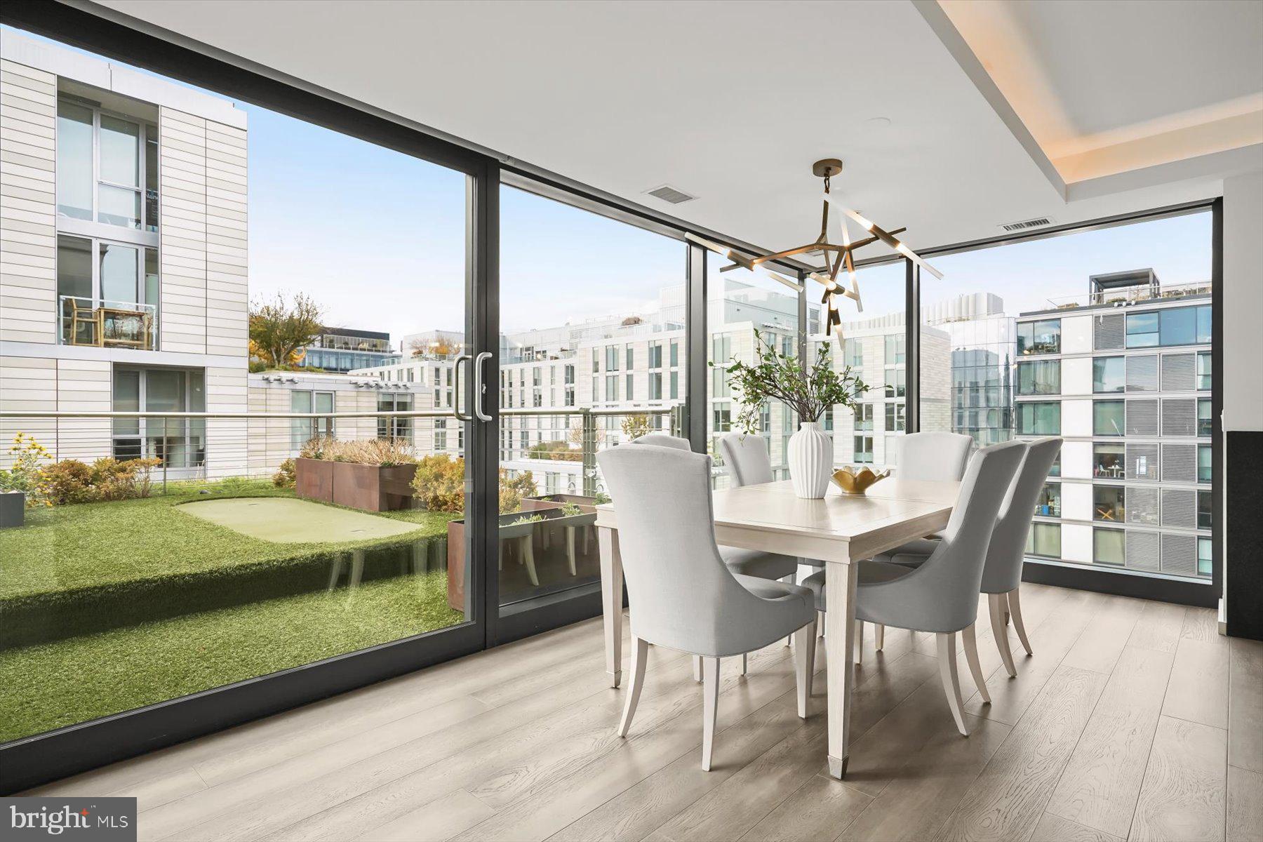 925 H Street Northwest, Unit 901/902 Washington, DC 20001 - Photo 5 of 29 a view of a dining room with furniture window and wooden floor