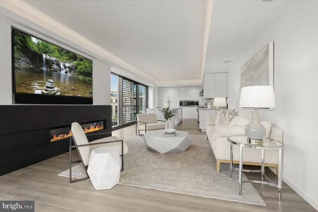 a living room with furniture a lamp and a window