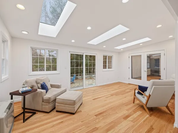 a living room with furniture and windows