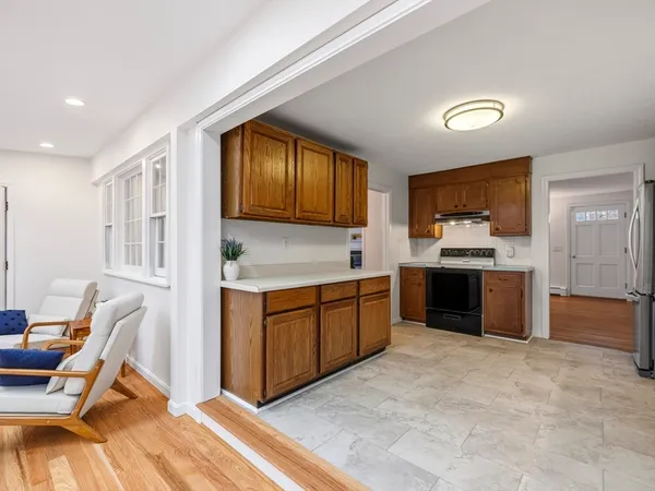 a kitchen with a stove a sink and a refrigerator