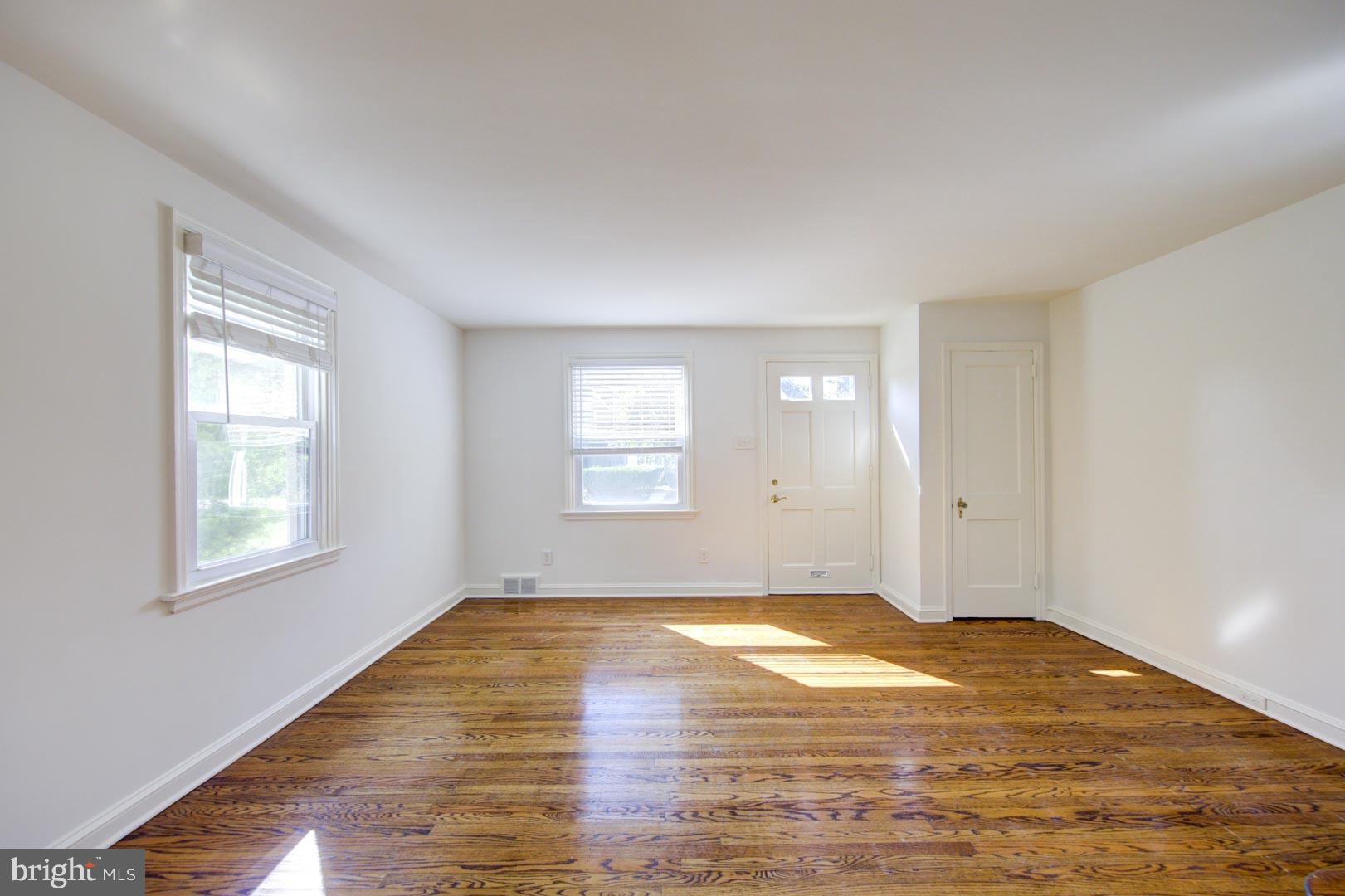 273 South Devon Avenue Wayne, PA 19087 - Photo 5 of 32 a view of empty room with wooden floor and fan