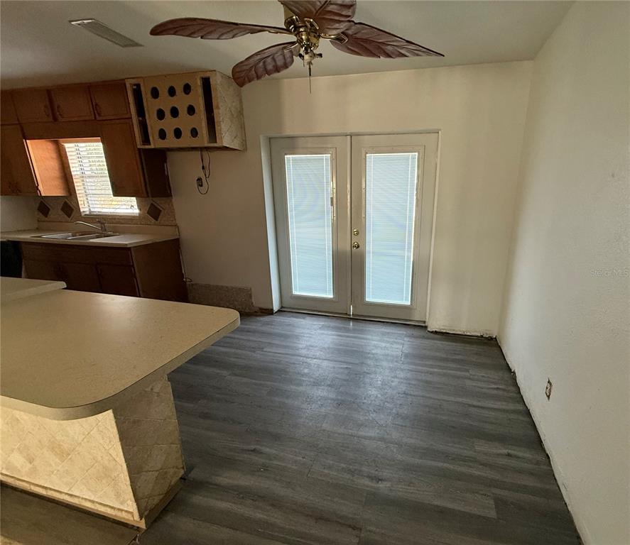 1129 Southwest Golden Avenue Arcadia, FL 34266 - Photo 11 of 25 a view of a hallway with wooden floor