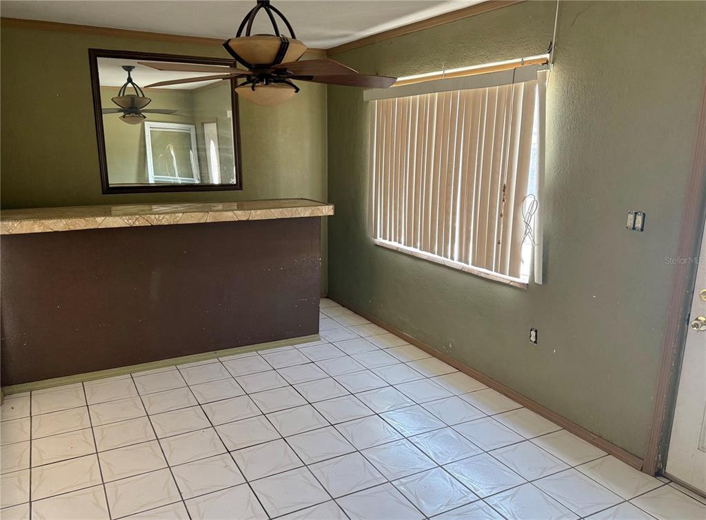 1129 Southwest Golden Avenue Arcadia, FL 34266 - Photo 7 of 25 a view of an empty room with a window