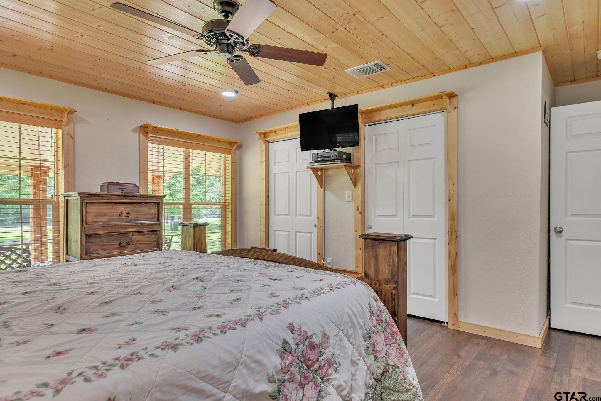 519 E Well Naples, TX 75568 - Photo 16 of 48 a bed room with a bed and a television
