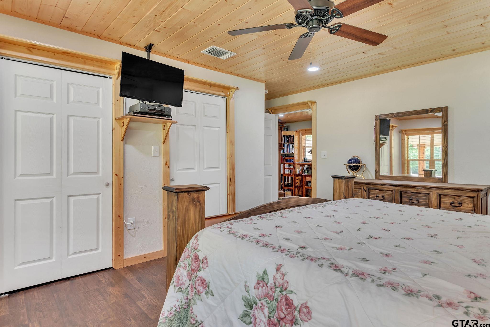 519 E Well Naples, TX 75568 - Photo 17 of 48 a bedroom with a bed and a flat screen tv