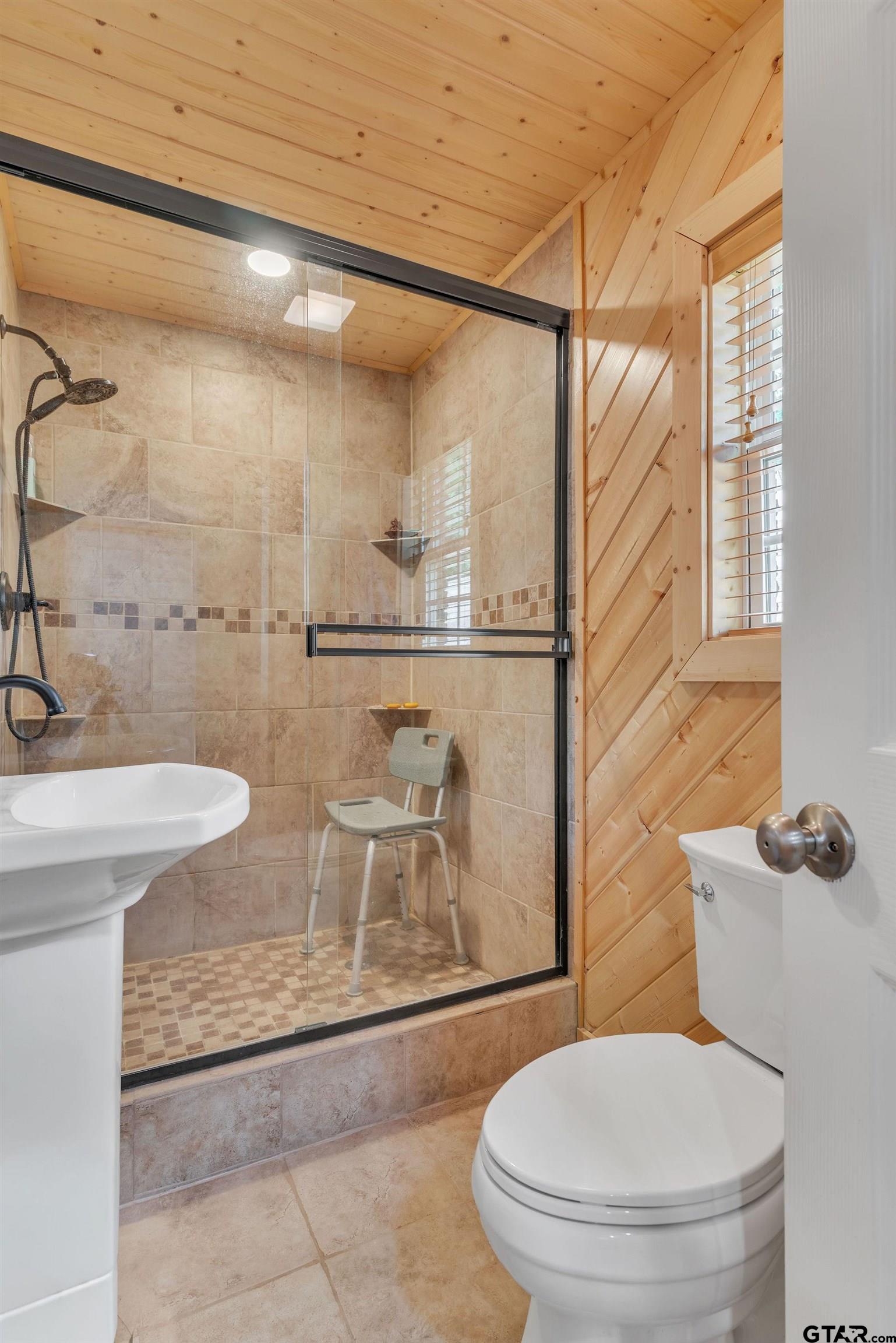 519 E Well Naples, TX 75568 - Photo 19 of 48 a bathroom with a toilet and a shower