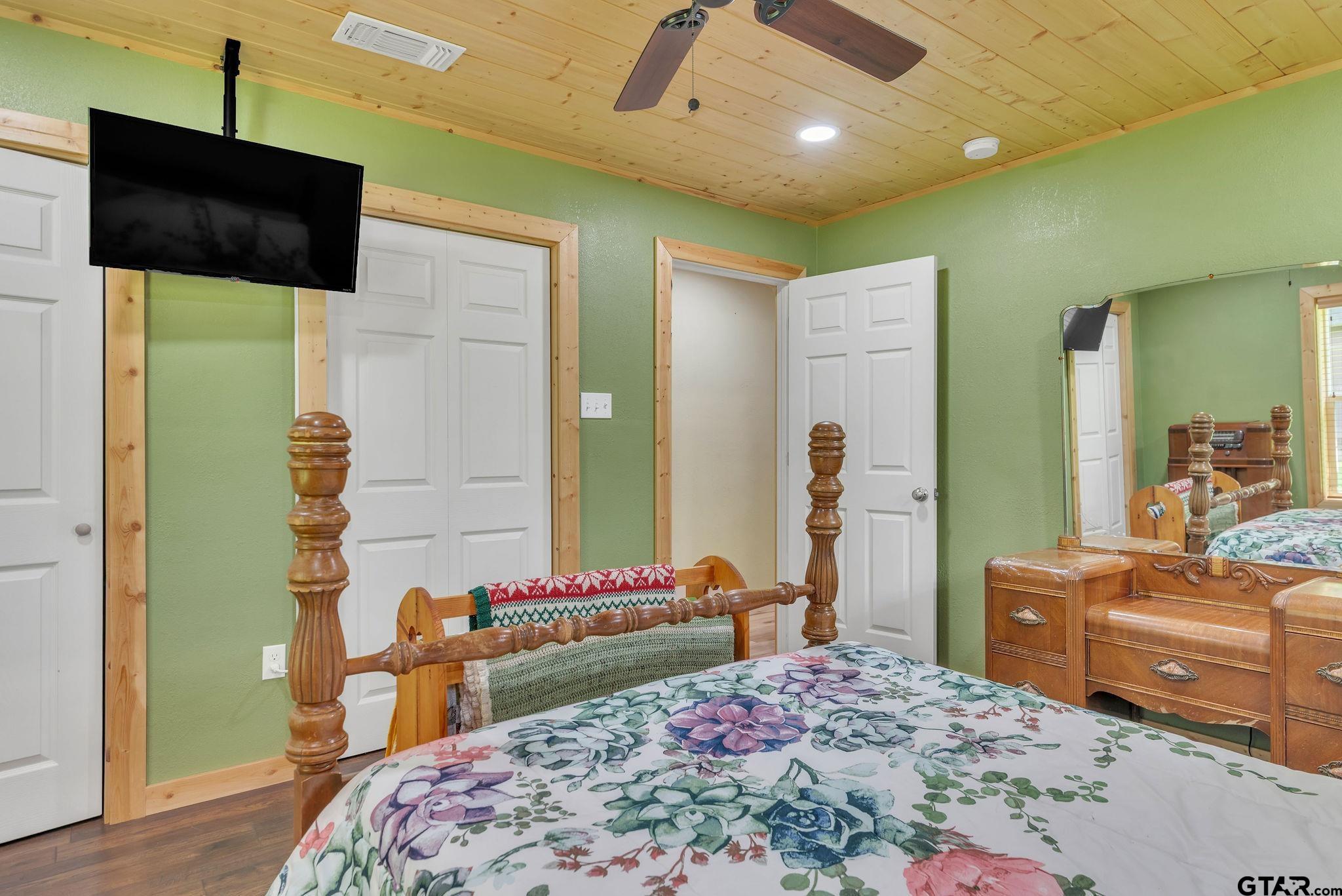 519 E Well Naples, TX 75568 - Photo 25 of 48 a bedroom with a bed and wooden floor
