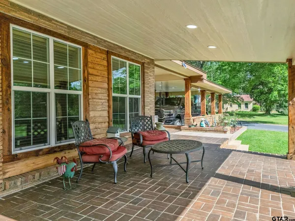 a backyard of a house with outdoor seating