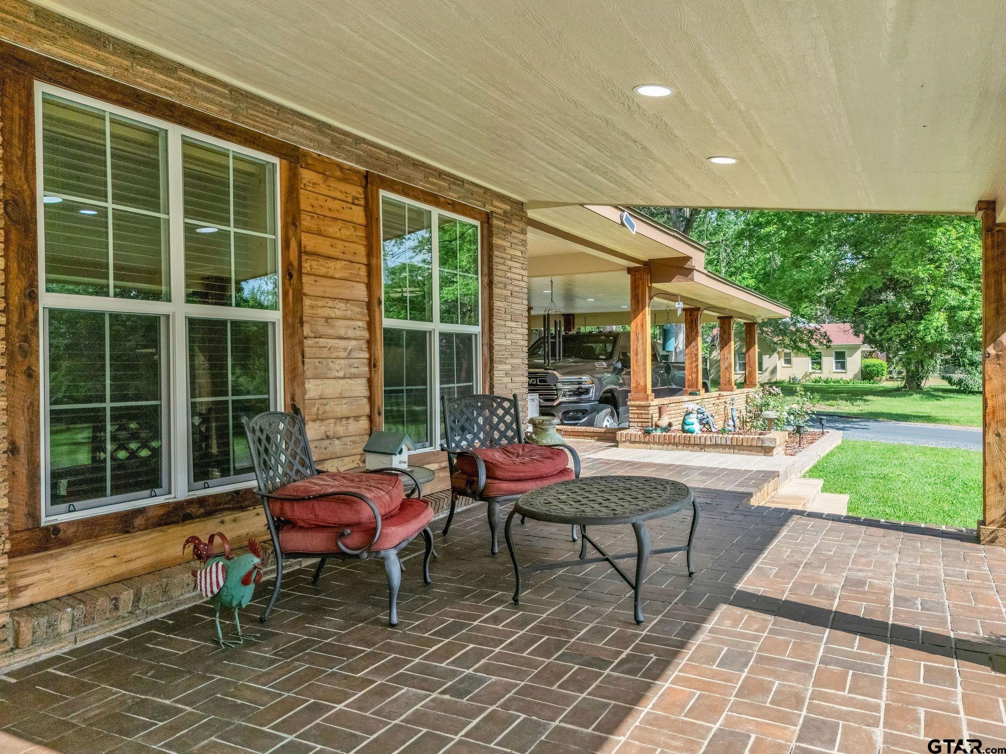 519 E Well Naples, TX 75568 - Photo 3 of 48 a backyard of a house with outdoor seating