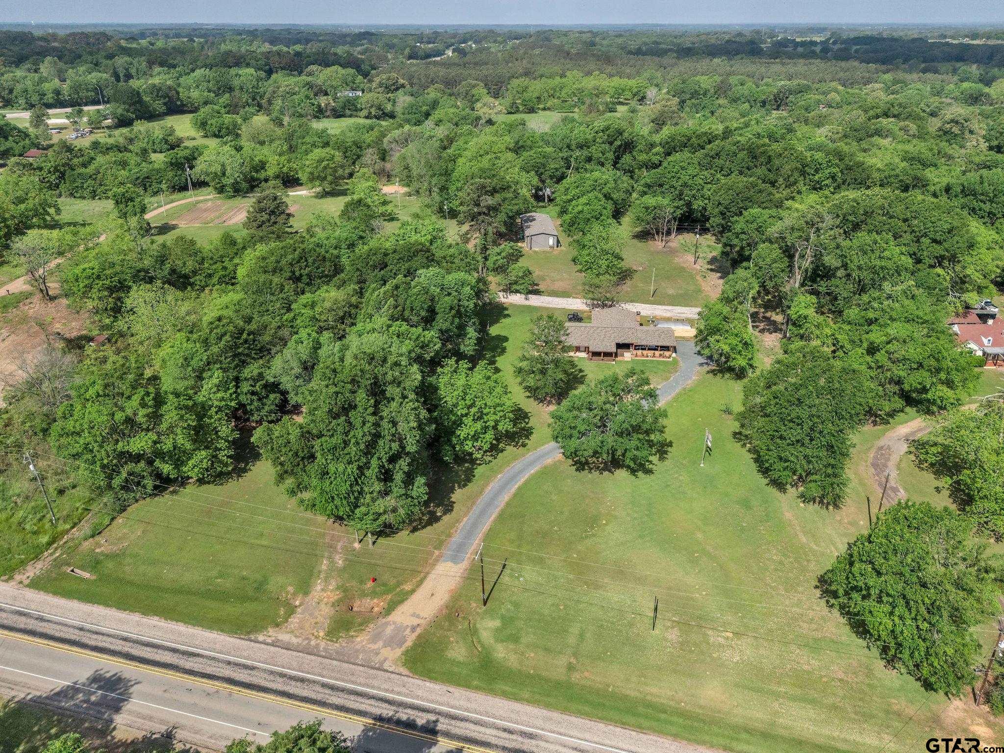 519 E Well Naples, TX 75568 - Photo 37 of 48 an aerial view of residential house with outdoor space