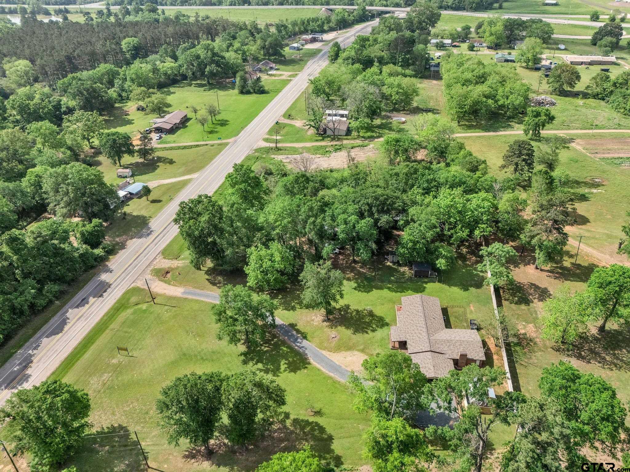 519 E Well Naples, TX 75568 - Photo 39 of 48 an aerial view of residential house with outdoor space and swimming pool