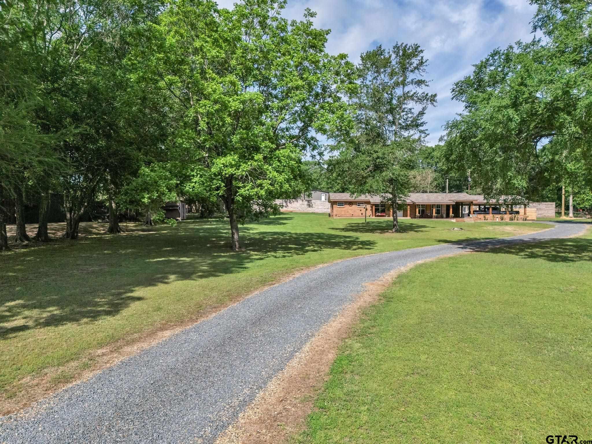 519 E Well Naples, TX 75568 - Photo 41 of 48 a view of a park with large trees