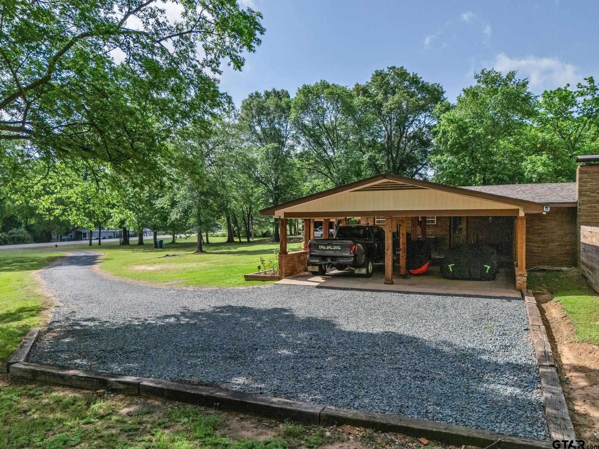 519 E Well Naples, TX 75568 - Photo 46 of 48 a view of a house with swimming pool and a yard
