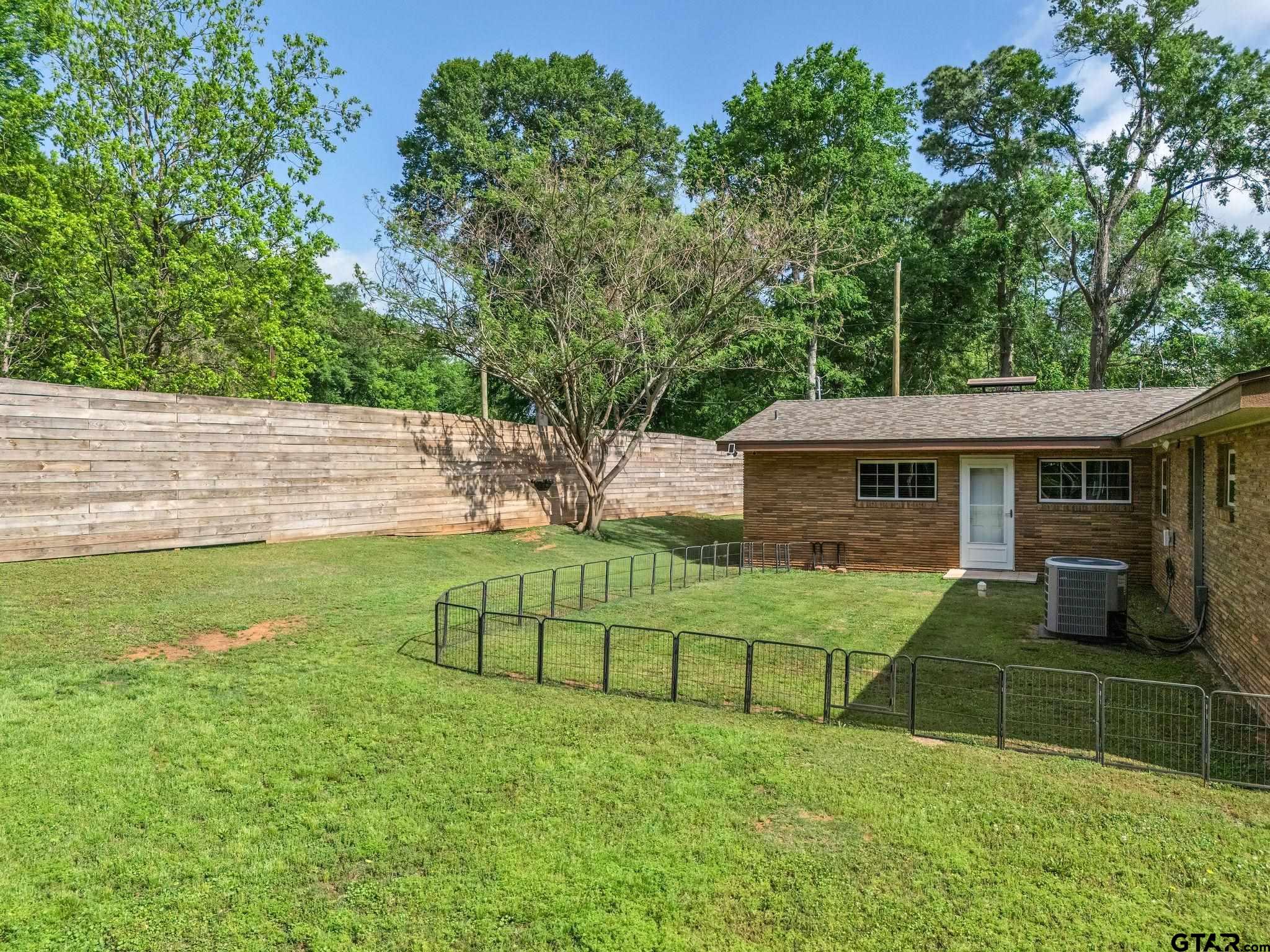 519 E Well Naples, TX 75568 - Photo 47 of 48 a view of a house with a yard