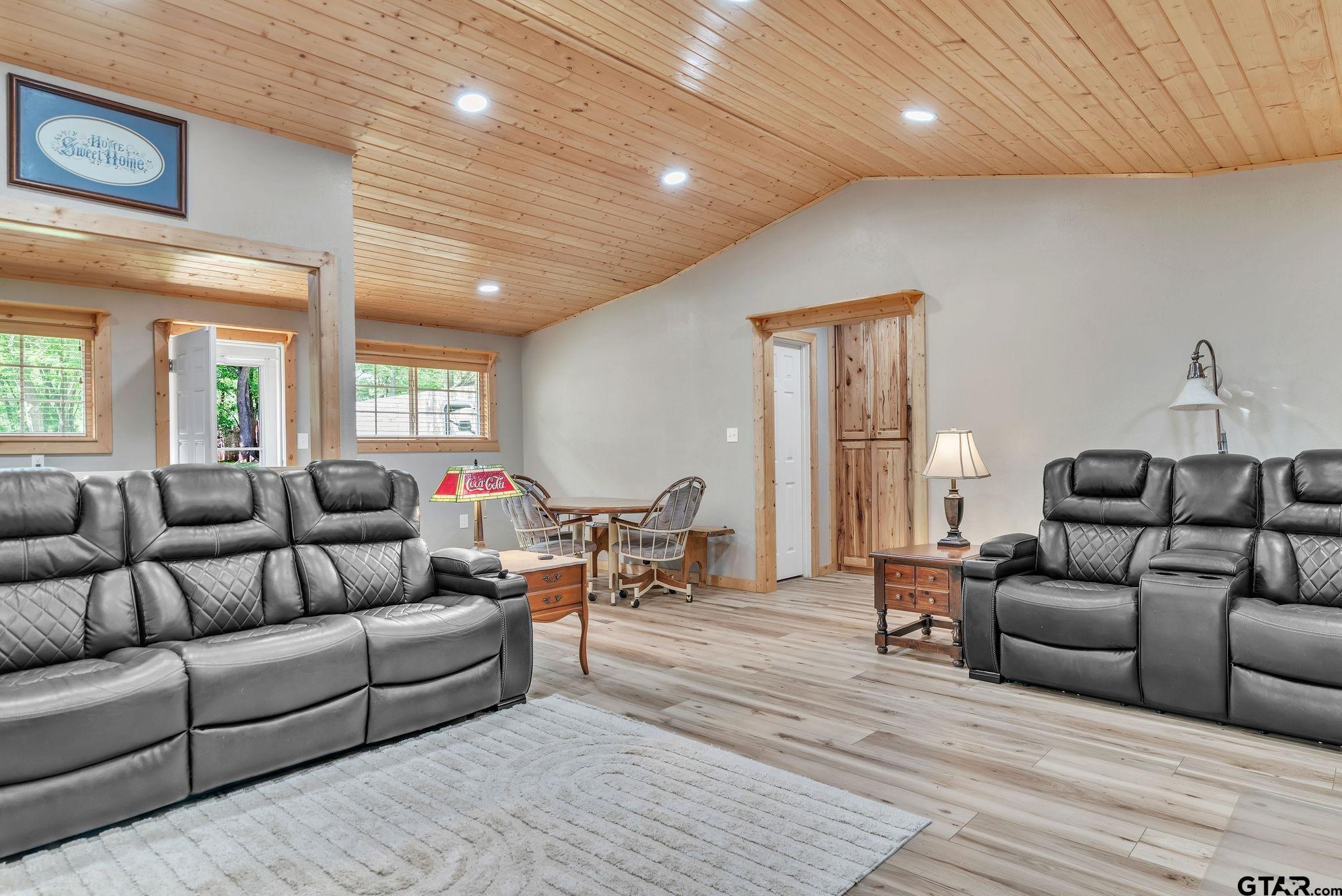519 E Well Naples, TX 75568 - Photo 7 of 48 a living room with furniture and a wooden floor