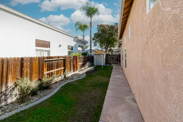 a view of a back yard with a house