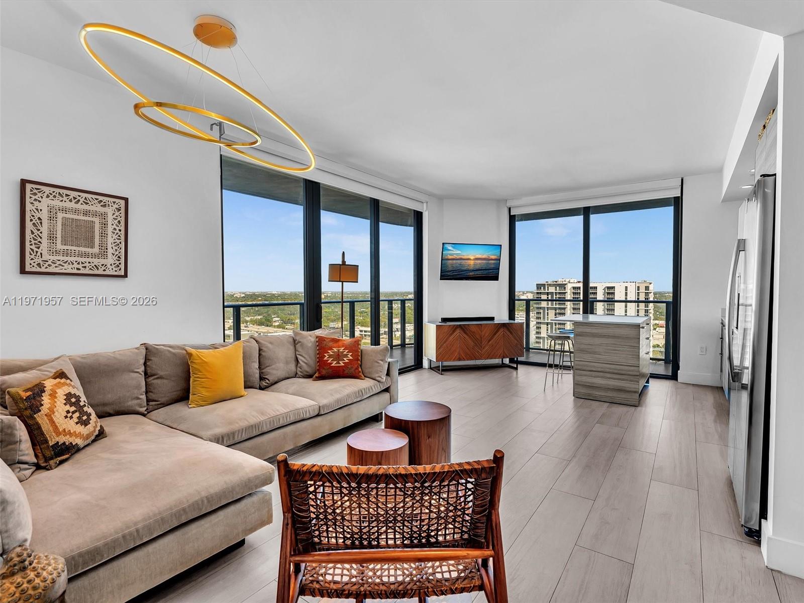 121 Northeast 34th Street, Unit 2016 Miami, FL 33137 - Photo 3 of 55 a living room with furniture and a table