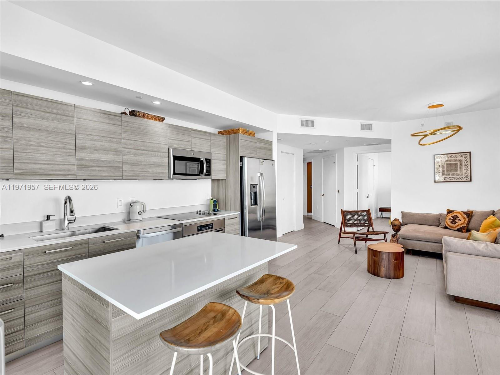 121 Northeast 34th Street, Unit 2016 Miami, FL 33137 - Photo 34 of 55 a living room with furniture kitchen view and a large window