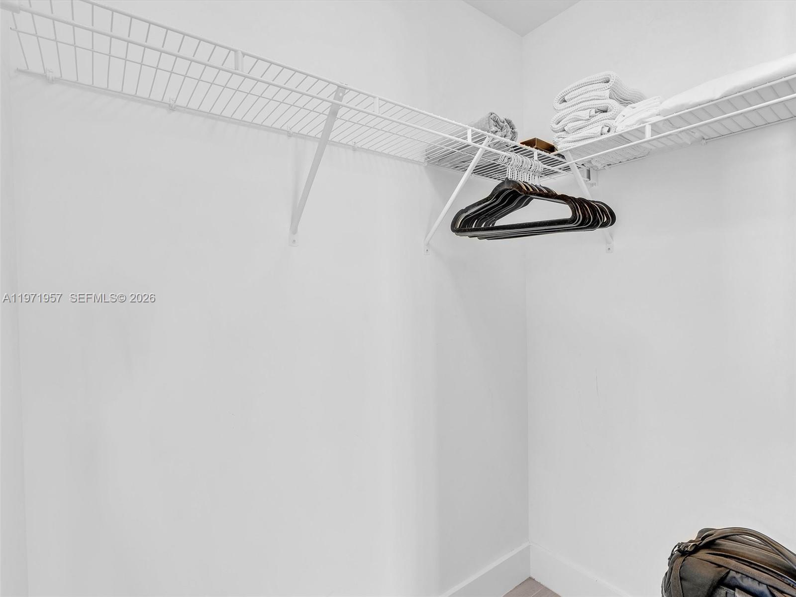 121 Northeast 34th Street, Unit 2016 Miami, FL 33137 - Photo 44 of 55 a view of a room with rack on the wall