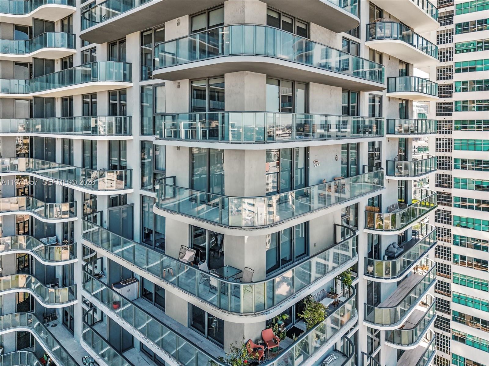 121 Northeast 34th Street, Unit 2016 Miami, FL 33137 - Photo 50 of 55 a large building with a lot of windows