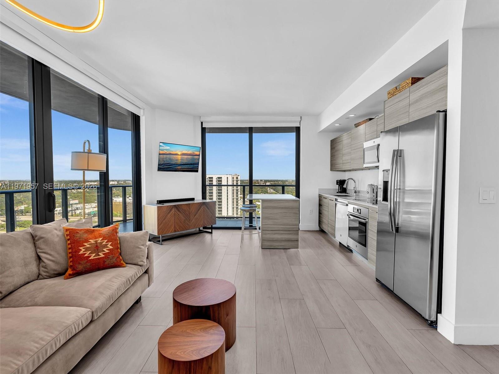 121 Northeast 34th Street, Unit 2016 Miami, FL 33137 - Photo 7 of 55 a living room with furniture and a large window