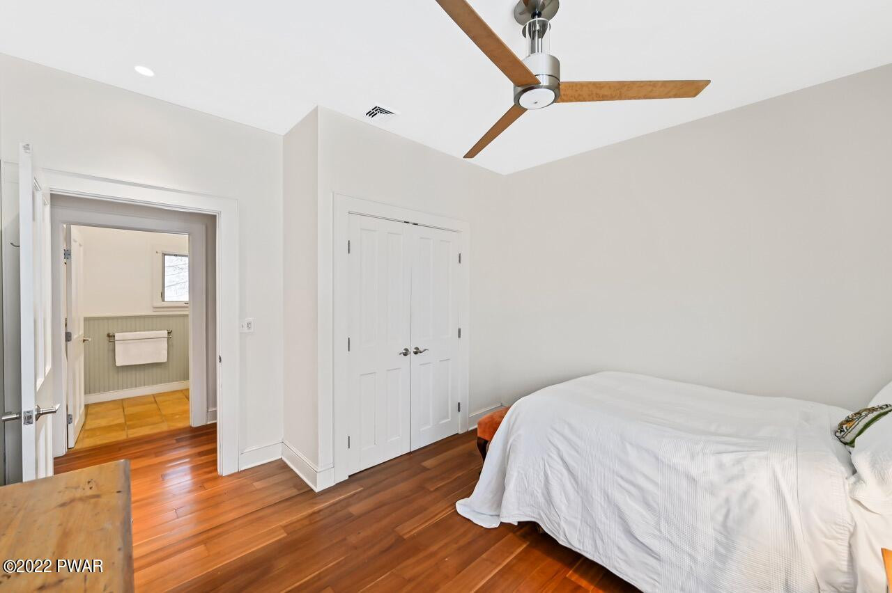 45 Tammany Flats Road Damascus, PA 18415 - Photo 51 of 73 a bed room with a bed and wooden floor