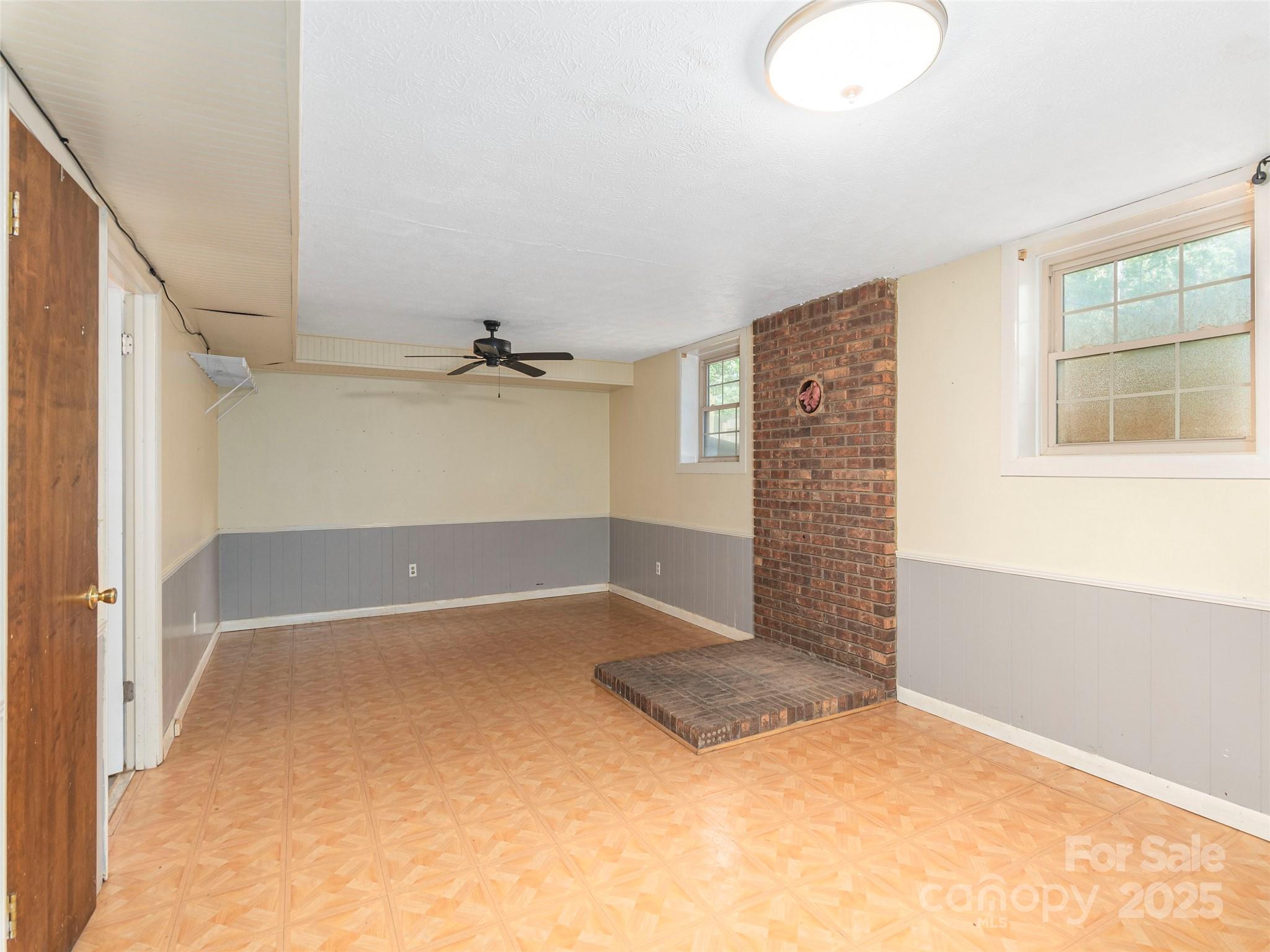 623 Nellie John Drive Clyde, NC 28721 - Photo 17 of 25 an empty room with windows