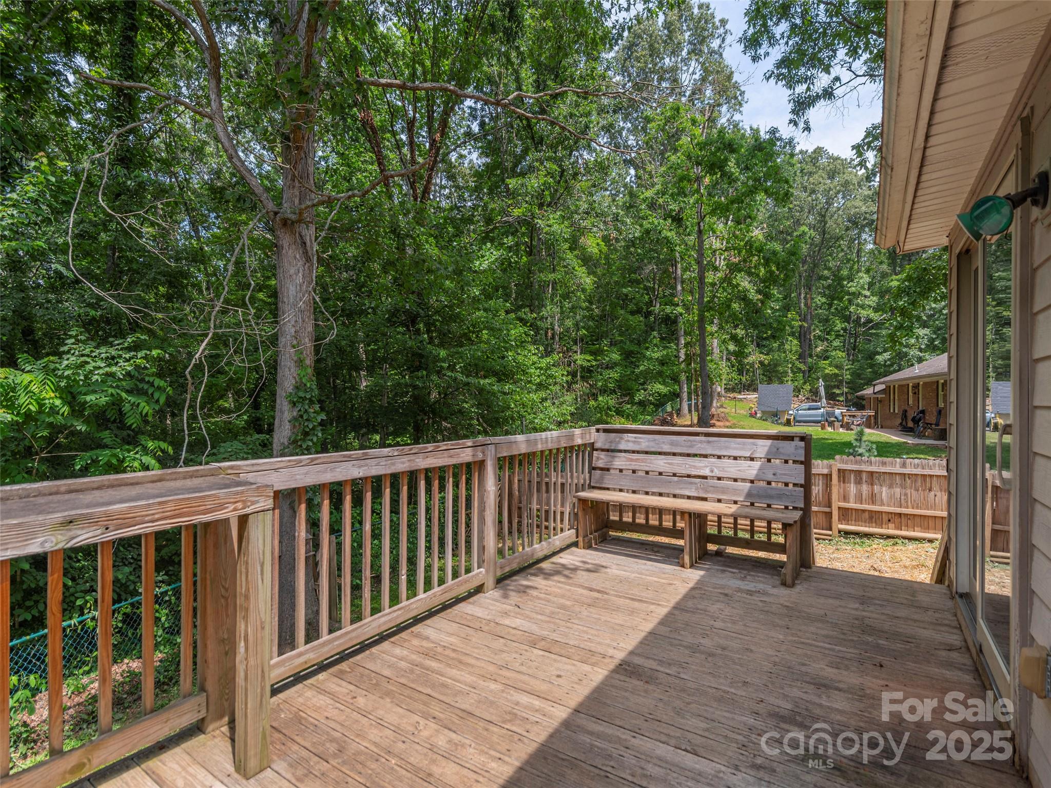 623 Nellie John Drive Clyde, NC 28721 - Photo 19 of 25 a view of backyard with deck and outdoor seating