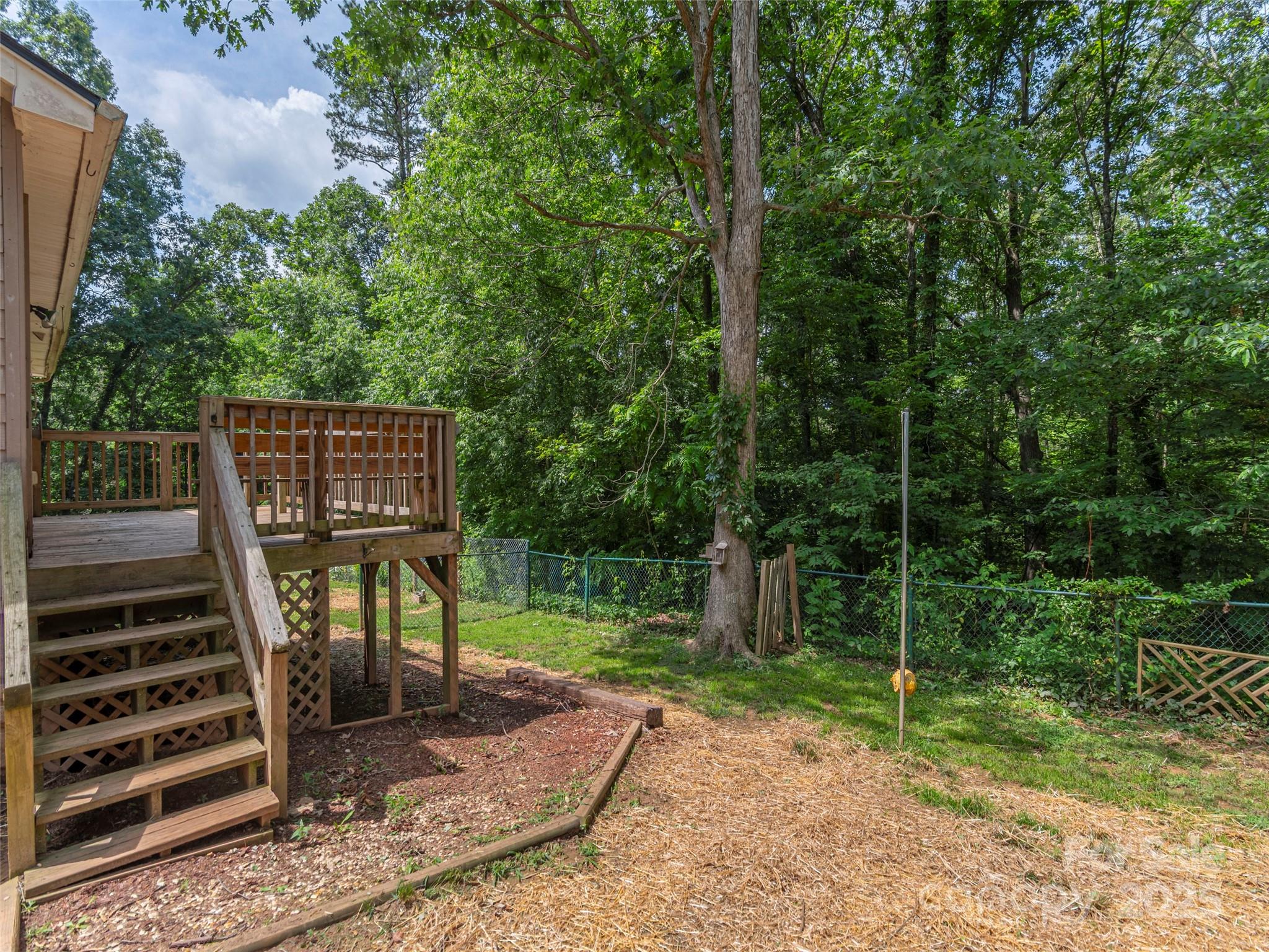 623 Nellie John Drive Clyde, NC 28721 - Photo 20 of 25 a view of a deck with a backyard