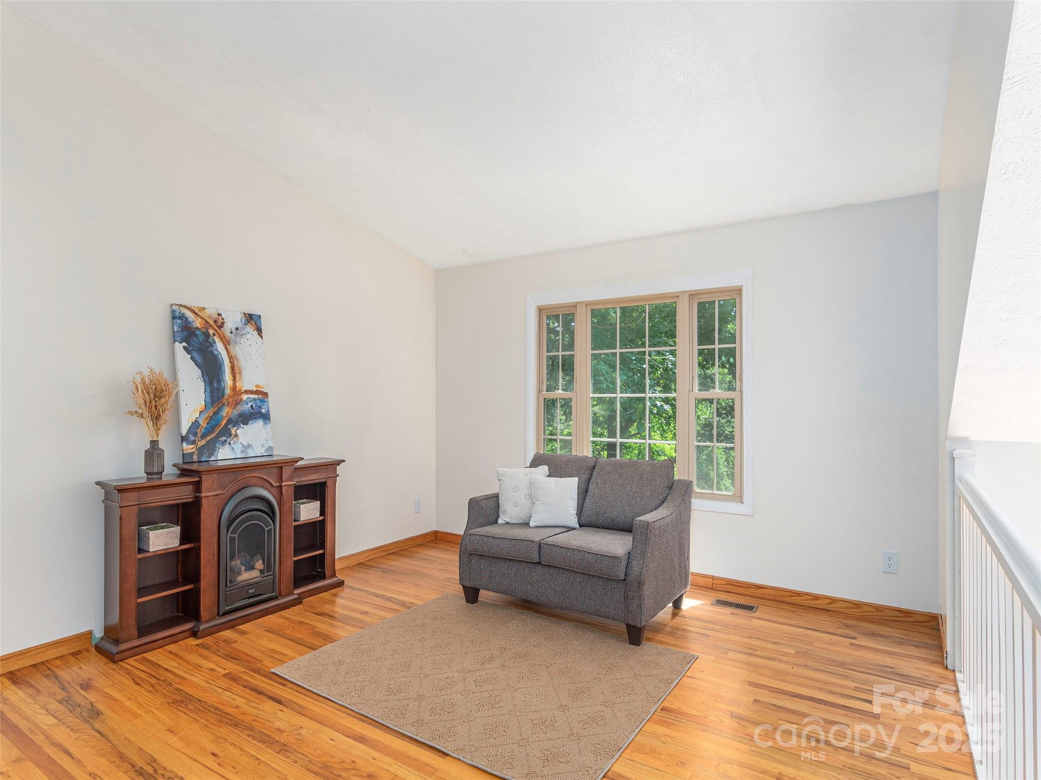 623 Nellie John Drive Clyde, NC 28721 - Photo 6 of 25 a living room with furniture and a fireplace