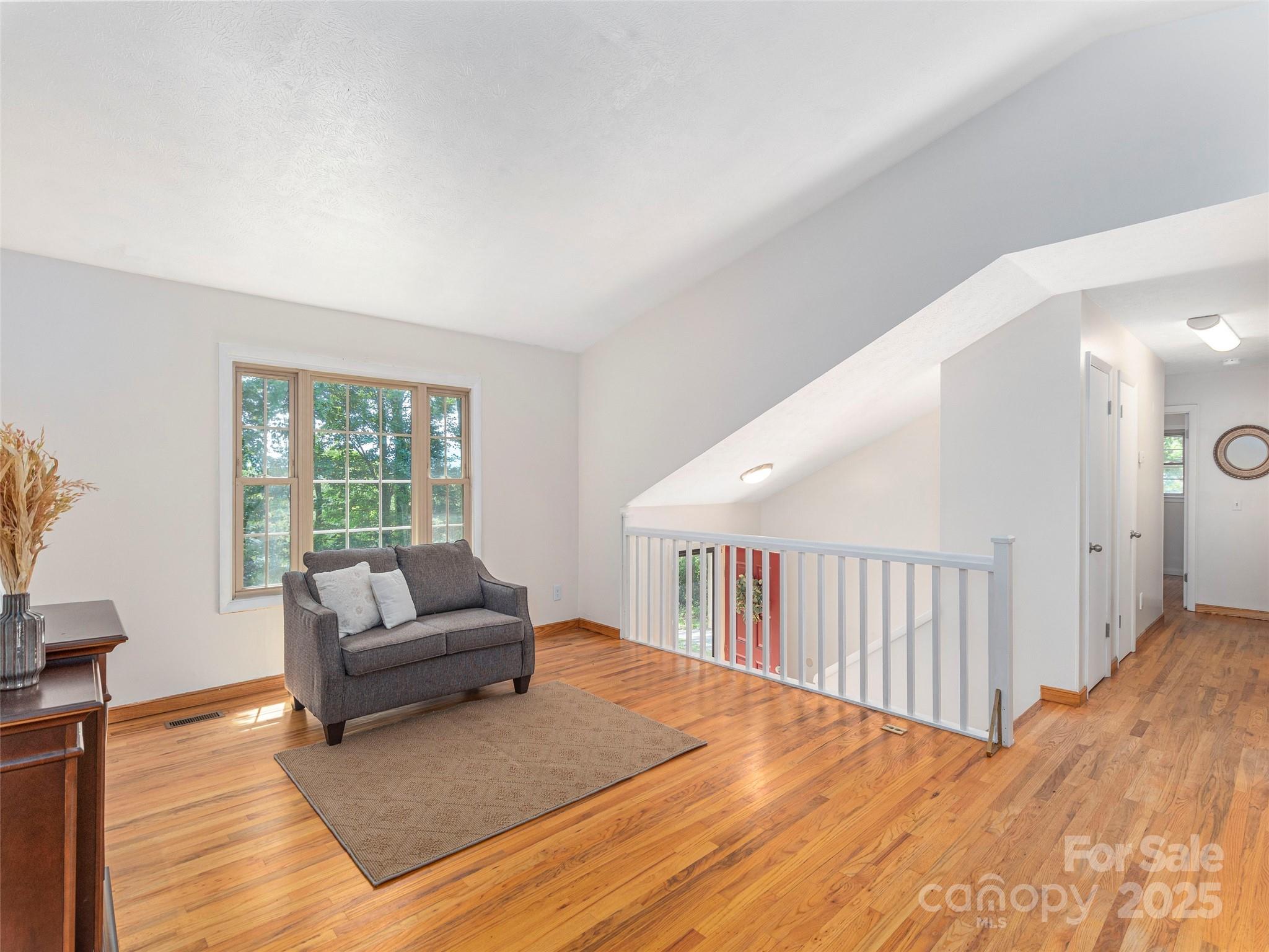 623 Nellie John Drive Clyde, NC 28721 - Photo 7 of 25 a living room with furniture and a large window