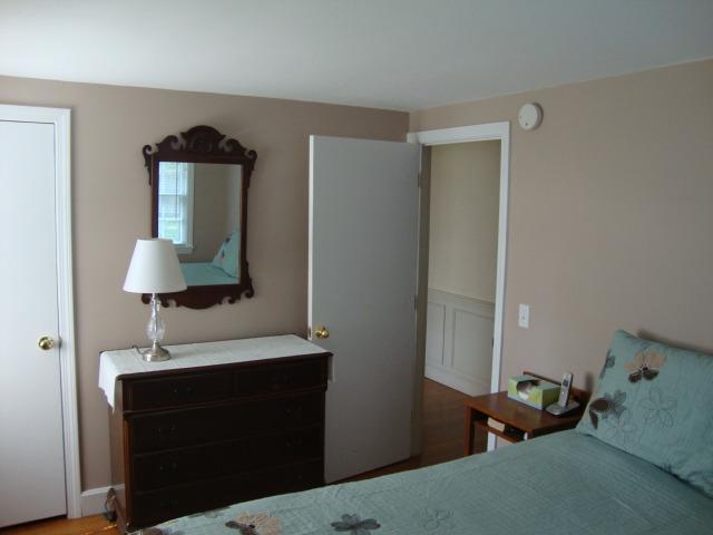 100 Huckins Neck Road Centerville, MA 02632 - Photo 15 of 28 a bedroom with a bed and a mirror