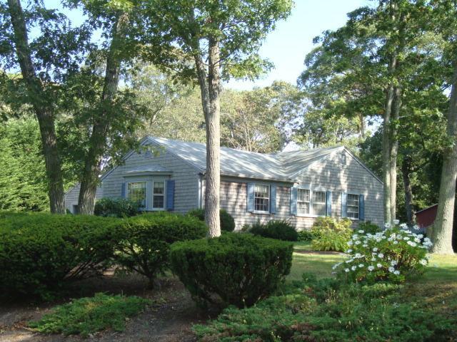100 Huckins Neck Road Centerville, MA 02632 - Photo 3 of 28 a front view of a house with a garden
