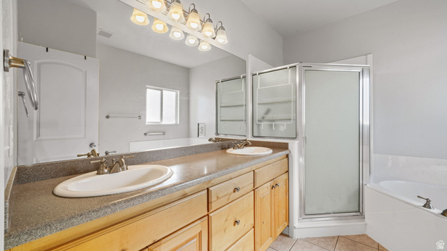 45 North 970 W Street Orem, UT 84057 - Photo 19 of 45 Primary bathroom with a tub, double vanity, and a stall shower
