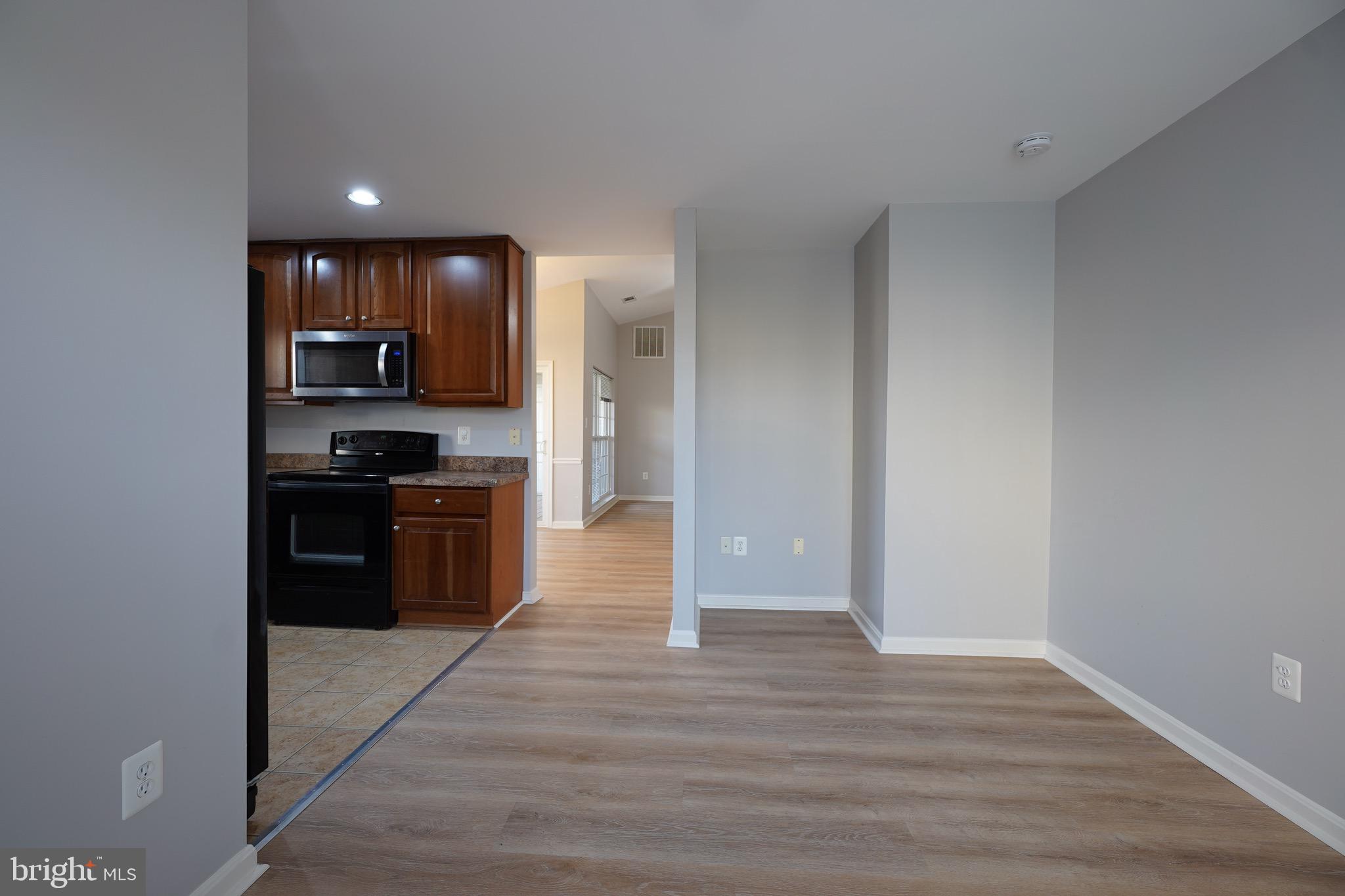 2502 Hemingway Drive, Unit 23B Frederick, MD 21702 - Photo 16 of 30 a kitchen with stainless steel appliances a refrigerator and a stove top oven