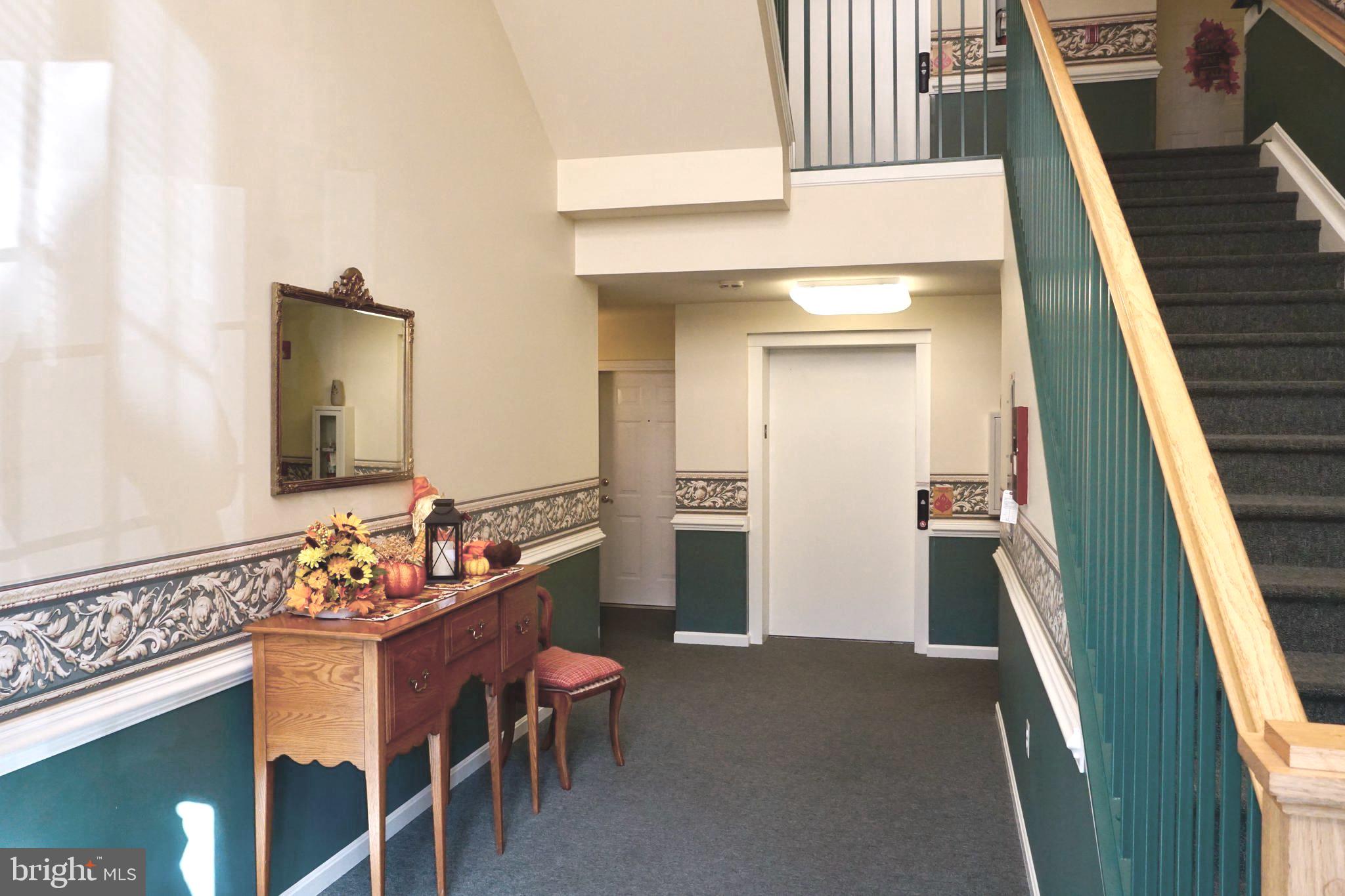 2502 Hemingway Drive, Unit 23B Frederick, MD 21702 - Photo 2 of 30 a bathroom with a sink a toilet and mirror