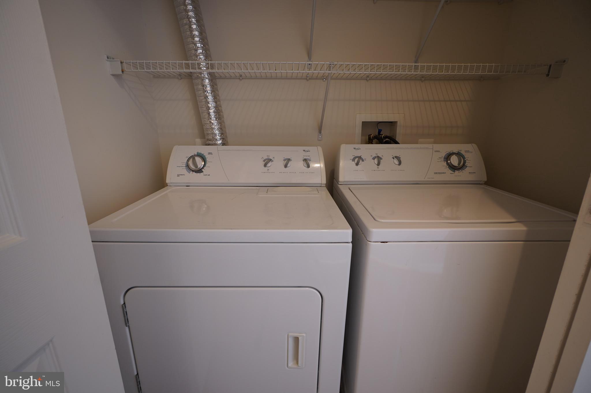 2502 Hemingway Drive, Unit 23B Frederick, MD 21702 - Photo 22 of 30 a utility room with dryer and washer