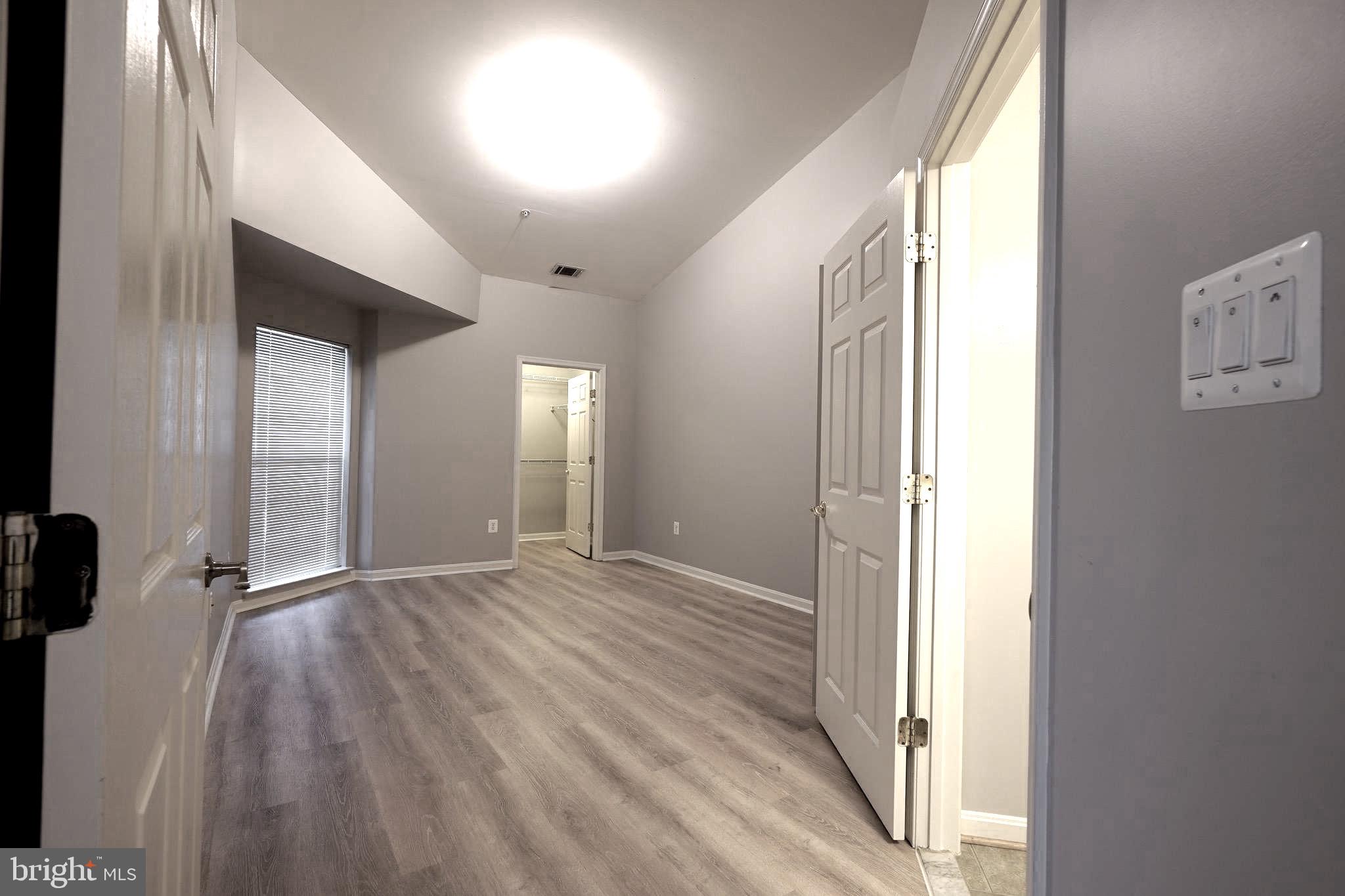 2502 Hemingway Drive, Unit 23B Frederick, MD 21702 - Photo 24 of 30 a view of empty room with wooden floor