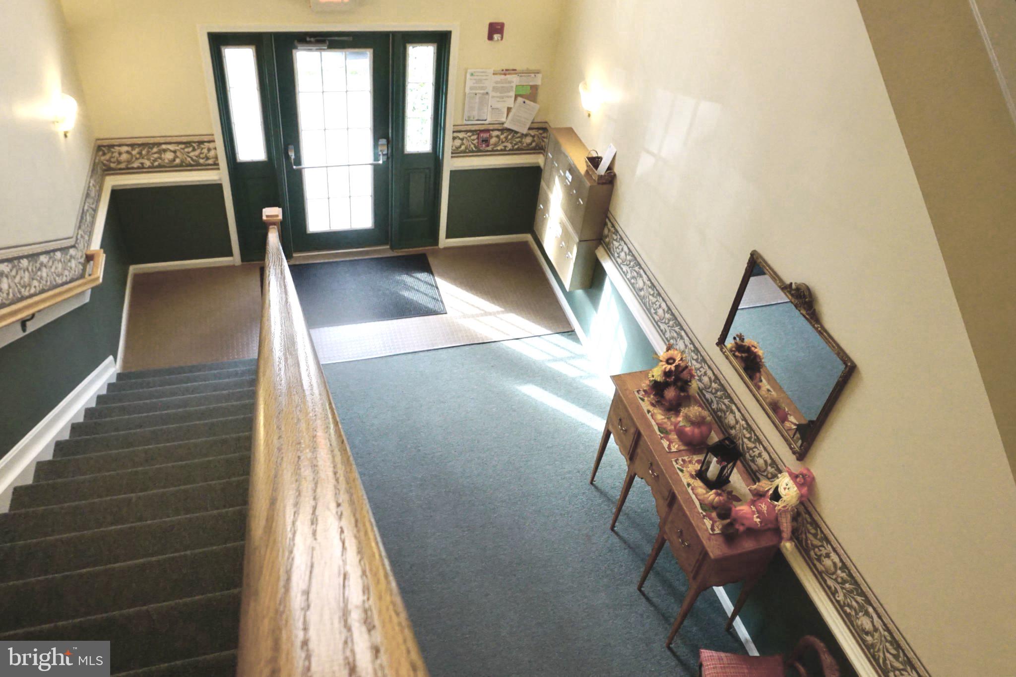 2502 Hemingway Drive, Unit 23B Frederick, MD 21702 - Photo 26 of 30 a view of a living room with furniture and a fireplace