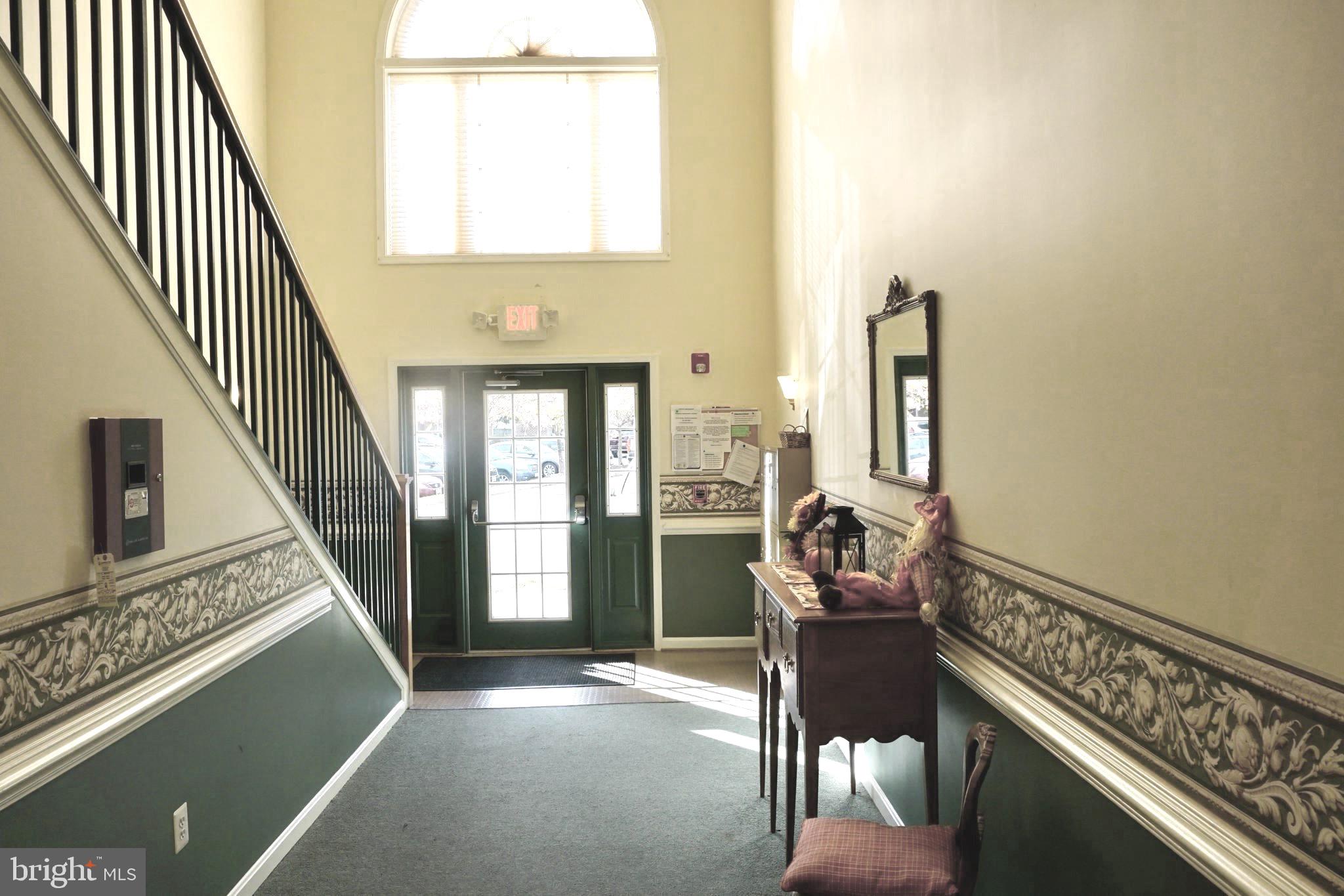 2502 Hemingway Drive, Unit 23B Frederick, MD 21702 - Photo 27 of 30 a living room with furniture and a window