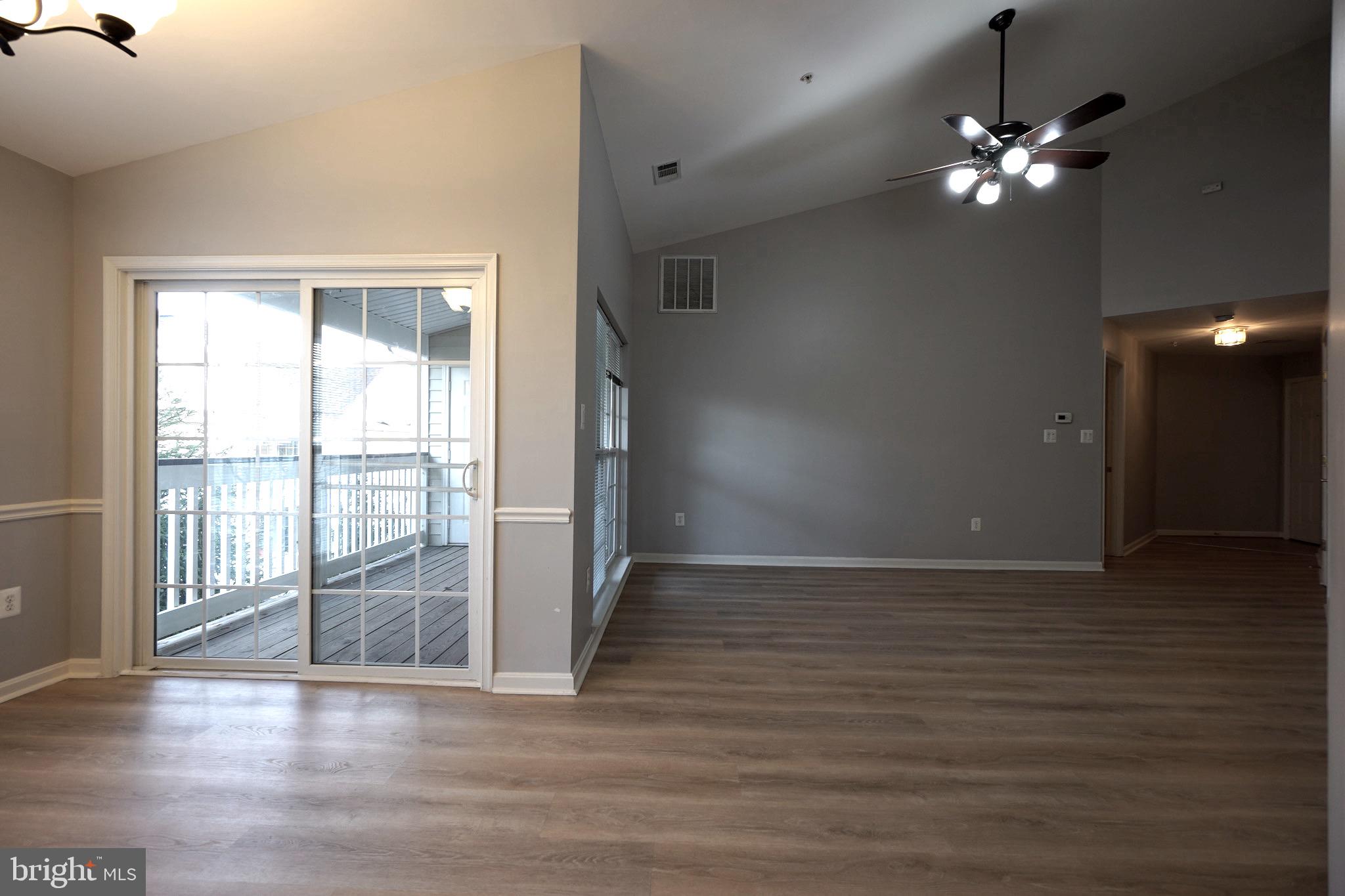 2502 Hemingway Drive, Unit 23B Frederick, MD 21702 - Photo 9 of 30 a view of a livingroom with a ceiling fan and window