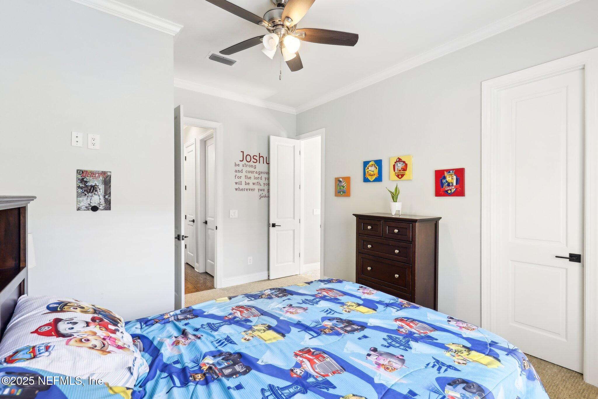 1836 Commodore Point Drive Fleming Island, FL 32003 - Photo 29 of 75 a bedroom with a bed and a dresser